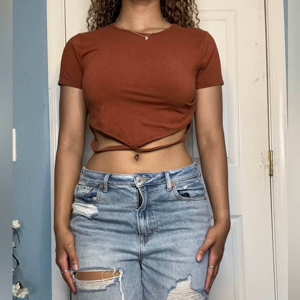 Burnt orange crop top, string design in front. Hollister. LARGE